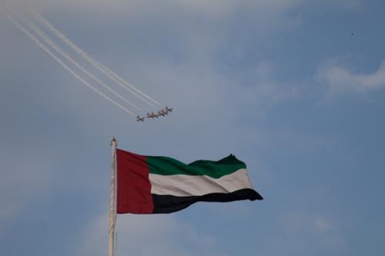 flag in the sky with military parade