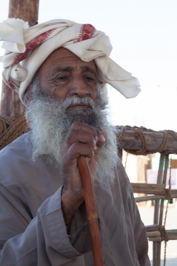 close up of an old man holding his crutch
