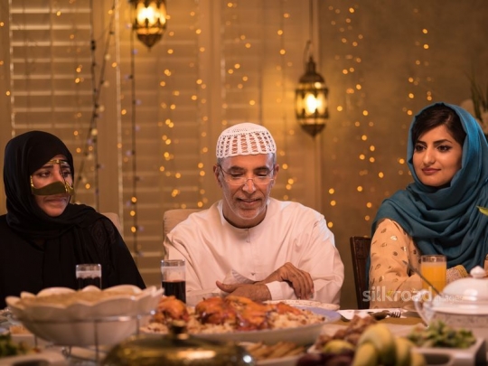 Parents with daughter over iftar|-