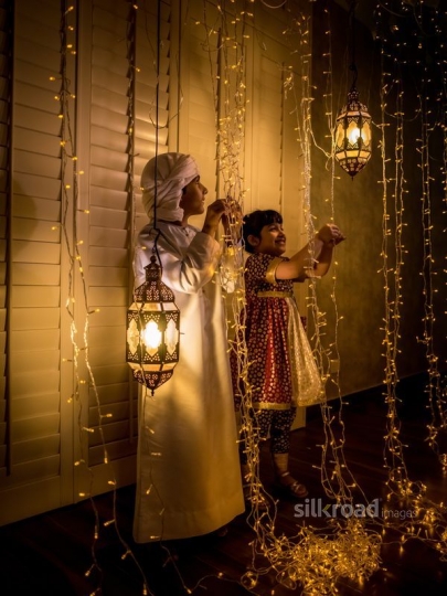 Girl and boy  fixing ornaments|-