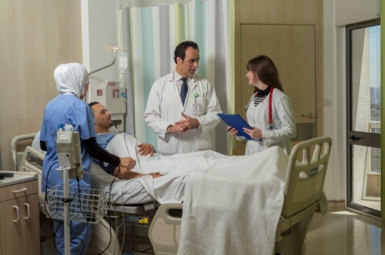 Doctors Checking on Patient at Hospital