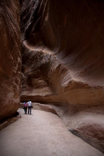 tourists walking in a passage