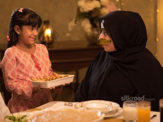 Girl serving grandmother puff pastry|-