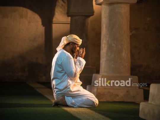 Old man praying t the mosque|-