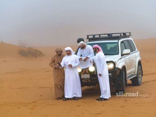 Friends hanging out in the desert