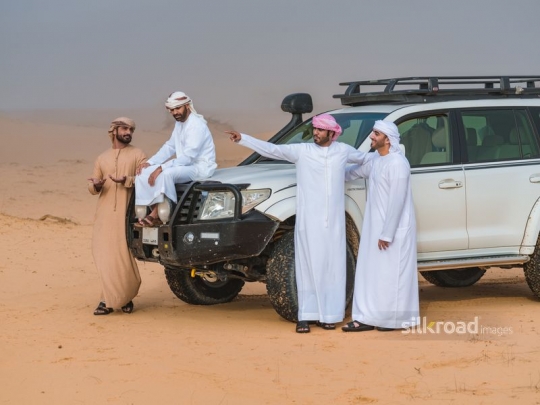 Men having a break in the desert