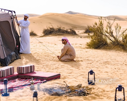Friends enjoying desert camp