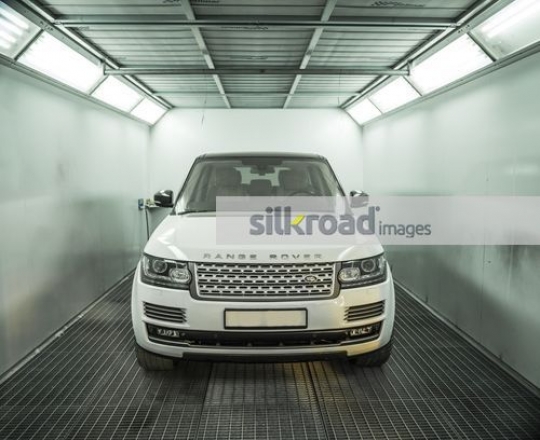 White car parked at the repair shop|