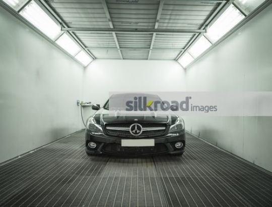 Black car parked at the repair shop|