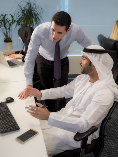 Portrait of business men communicating with each other at the workplace|