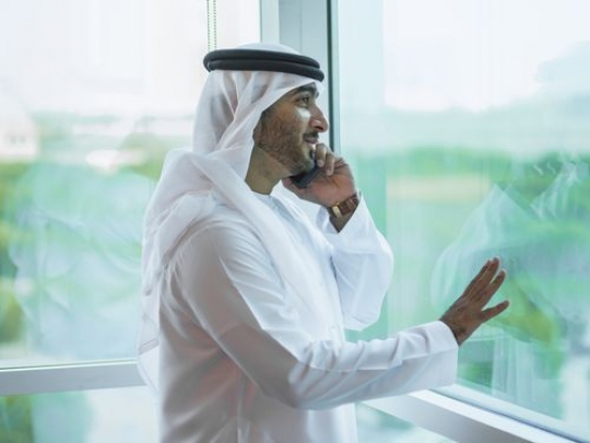 Mid-shot of an employee making a phone call|-