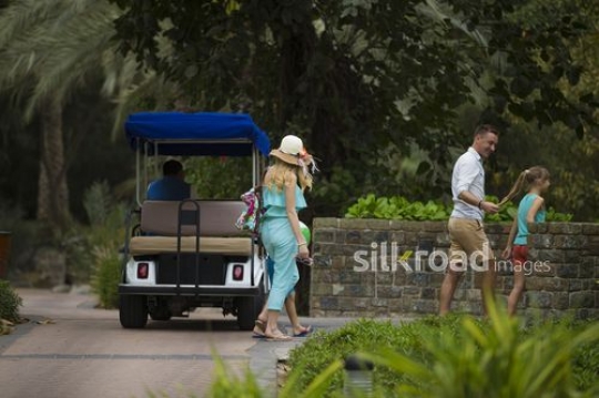 Western Family walking at the resort|-