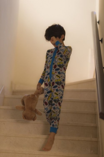 A young boy in his pyjamas |-