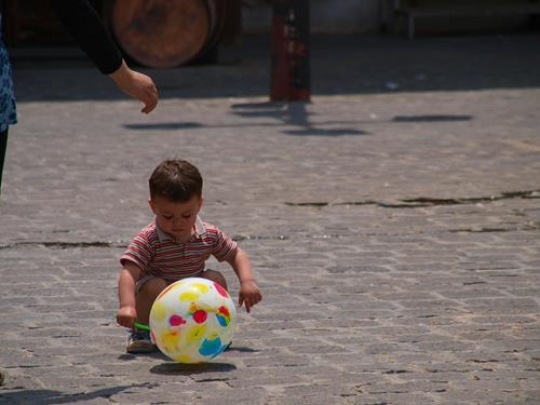 kid playing with a ball