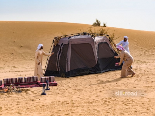 Friends putting up the tent