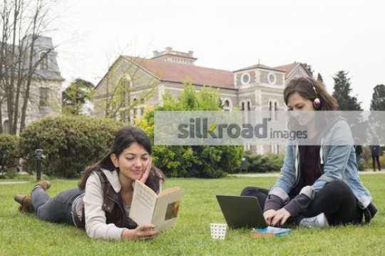 University Students sitting together studying|