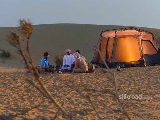 Friends gathering in the desert camp