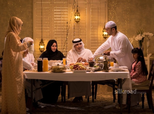 Parents serving iftar|-