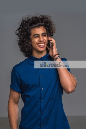 Middle Eastern man talking on the phone|