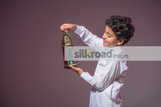 Young Arab boy celebrating |