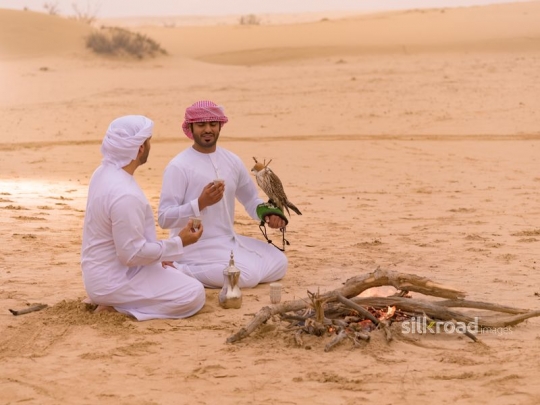 Friends drinking coffee in the desert