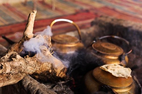 burning wood and traditional tea pots