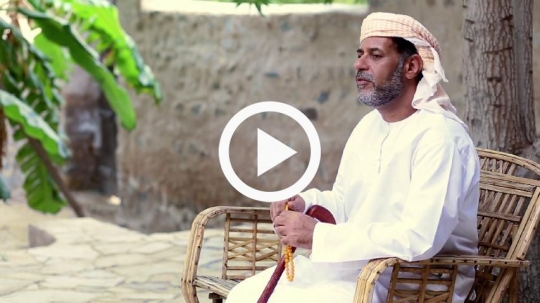 Old man sitting outside on the bench
