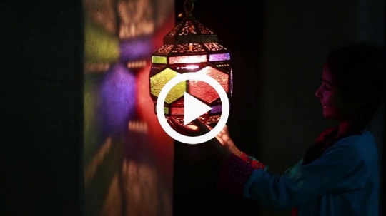 Girl rotating lantern joyfully