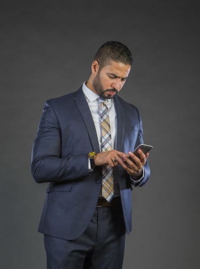 Businessman in a suit communicating|-