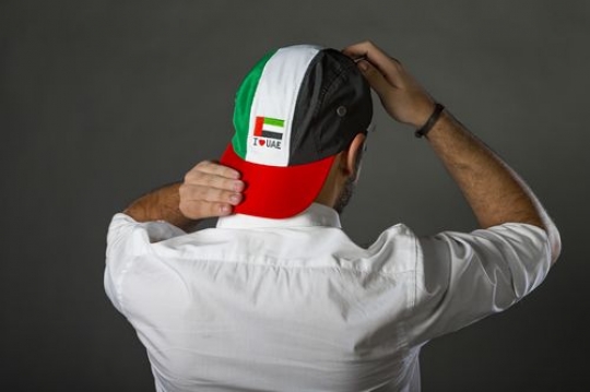 Man representing the UAE National Day with the hat
