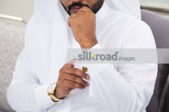 Businessman fixing the cufflink