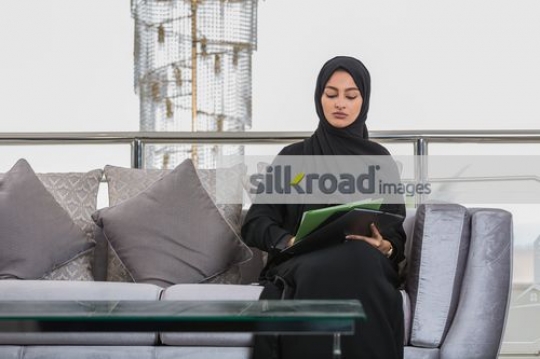 Business woman writing on her notepad