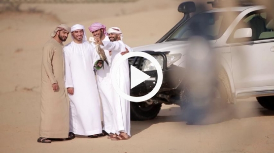 Men taking selfie together with the falcon