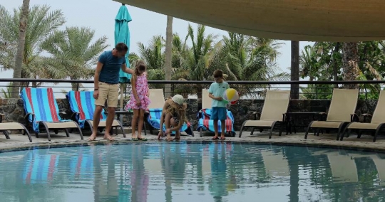 Western Family at the pool together|-