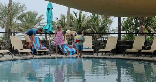 Western Family walking towards the pool|-