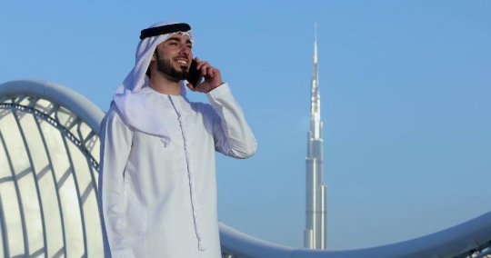 Middle Eastern Businessman makes a phone call|-