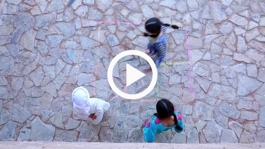 Top view of children jumping outside