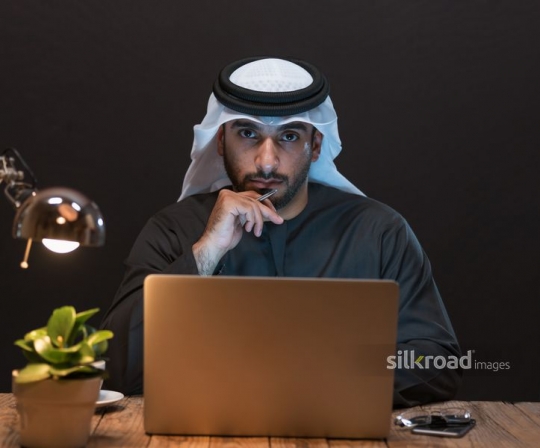 Man behind laptop