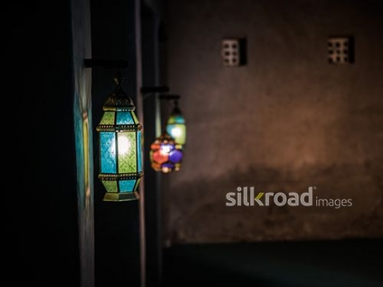 Lanterns in alignment on the wall|-