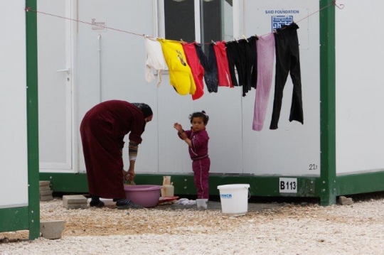 Women with her daughter from Zaatari refugee camp for Syrian refugees