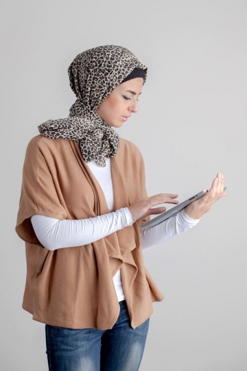 young woman holding ipad