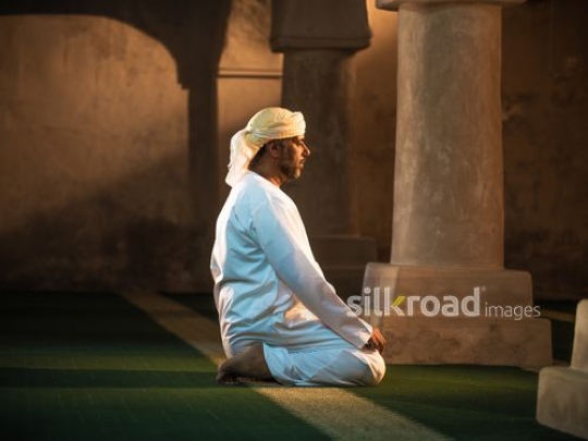 Old man praying at the mosque|-