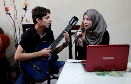 Palestinian Youth Playing Guitar