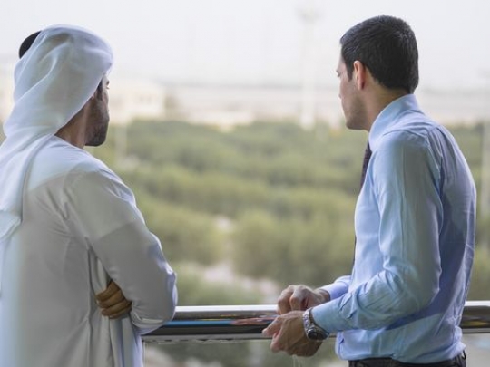 Two employees having a conversation outside|-