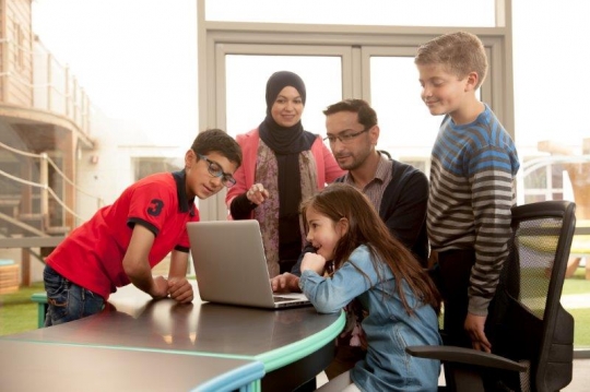 Kids and Teachers at Computer Class