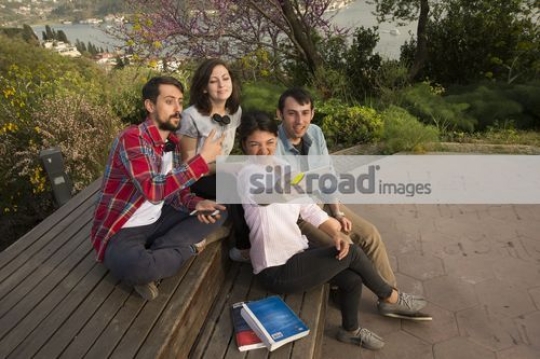 Group of men and women taking a picture together|
