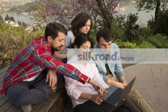 Group of Students talking to the professor|