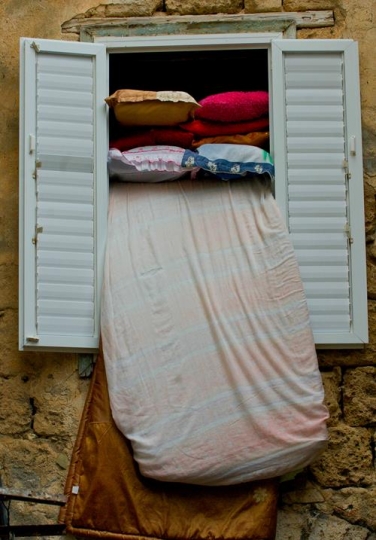 window with mattress and pillow