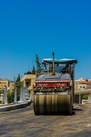 orange road-roller on repairing of the road