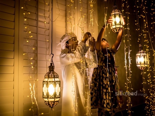 Kids hanging lanterns|-